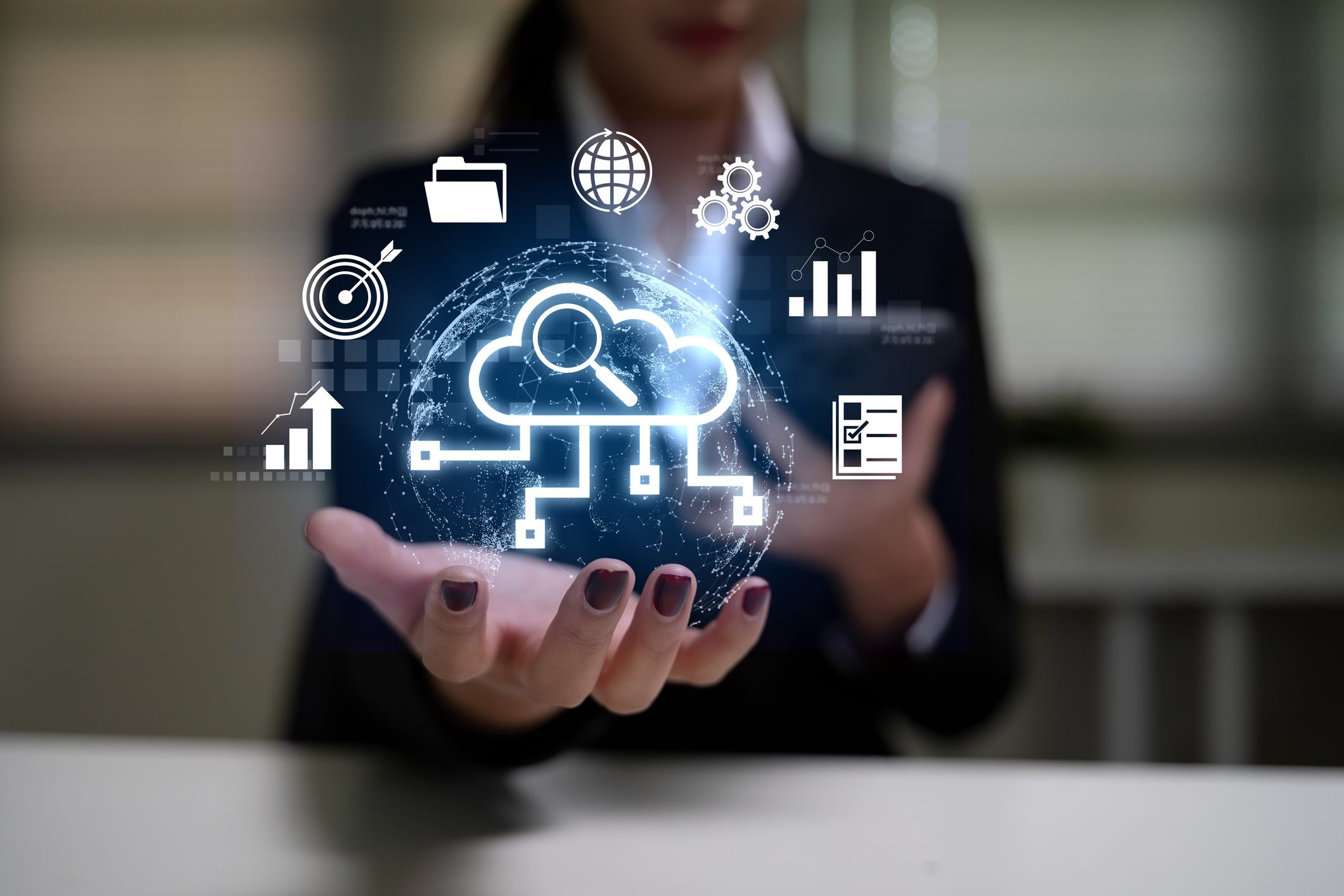 Businesswoman holding cloud computing symbols