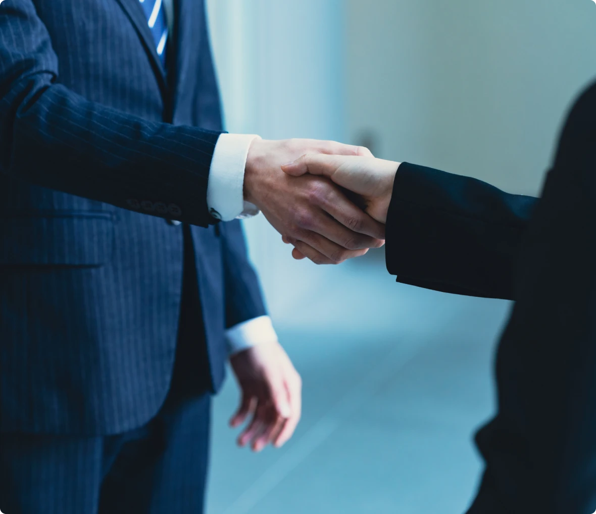 Business handshake in formal attire