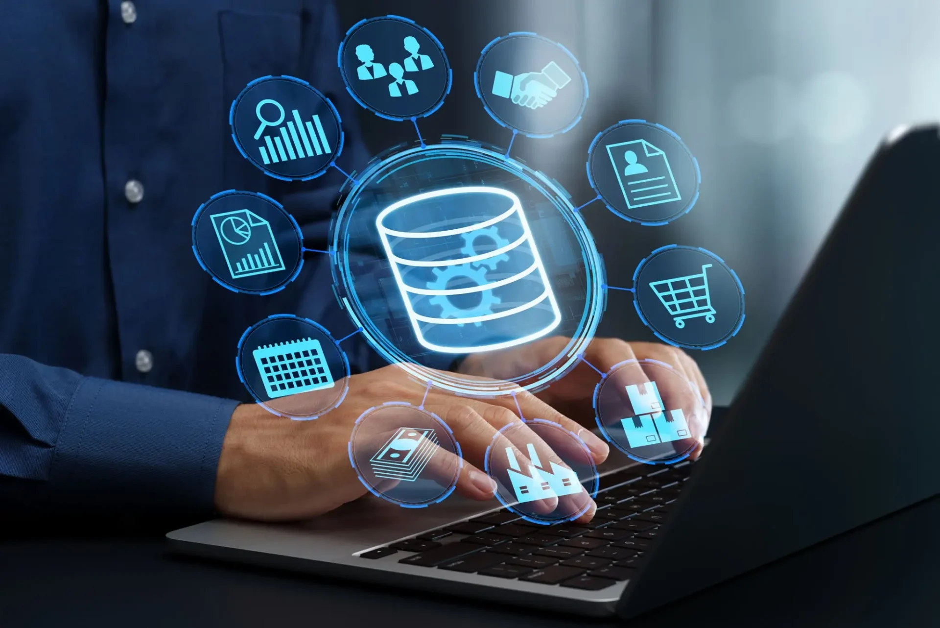 Person using laptop with floating database and data icons.